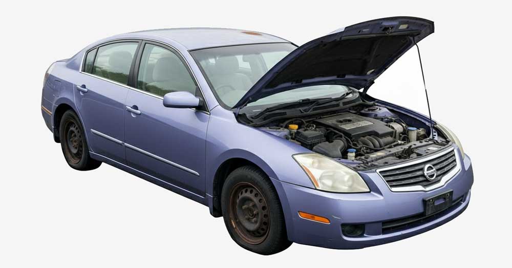 A non-running car with the hood up, being valued for a cash offer