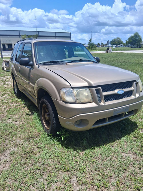 Sun-faded 2002 Ford Explorer junked in Fort Myers, FL